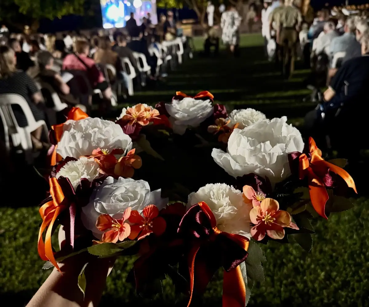 Shared commemorative wreath during the ANZAC Day service