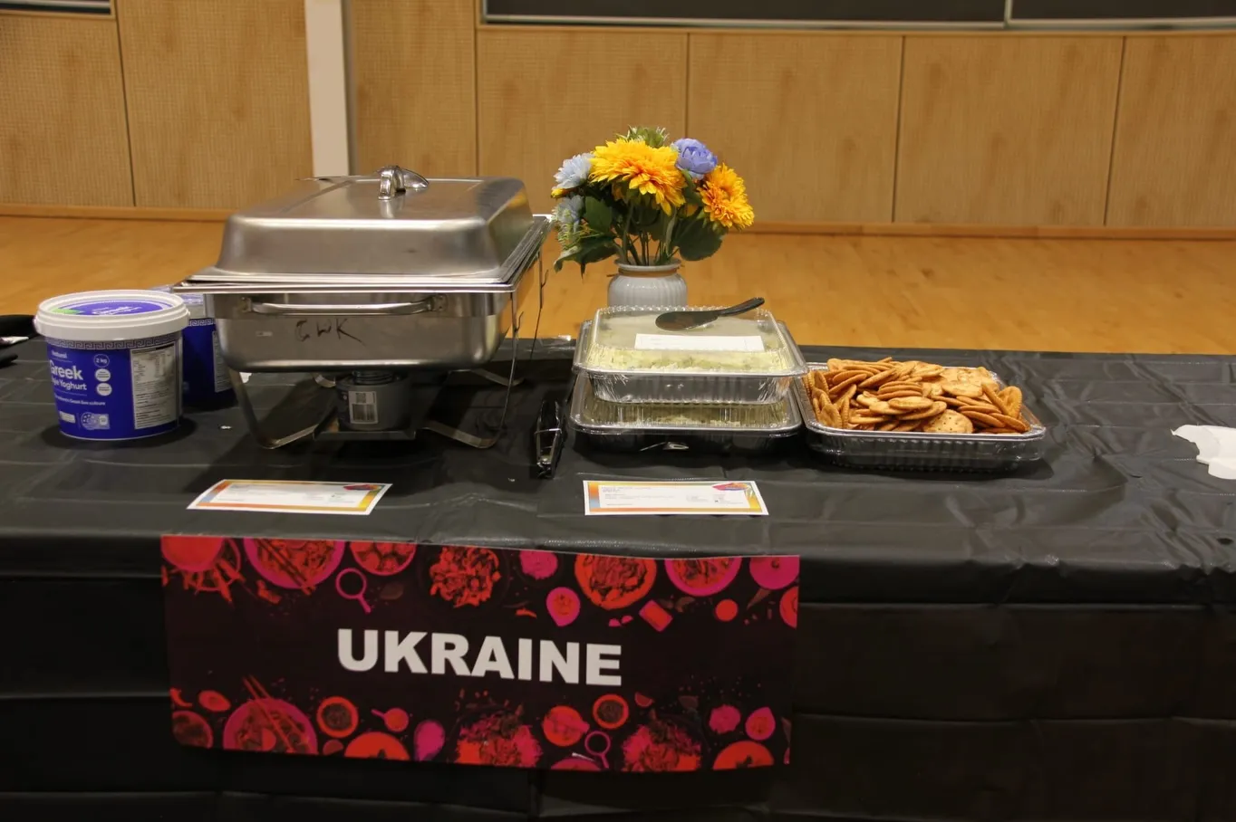 Ukraine food table with varenyky and Ukrainian colours