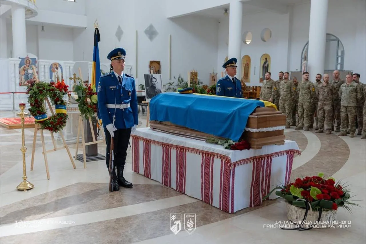 Honour guard and mourners paying tribute at the memorial service